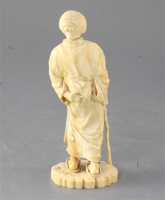 A Japanese ivory figure of an old lady, Tokyo School, Meiji period, height 18.5cm